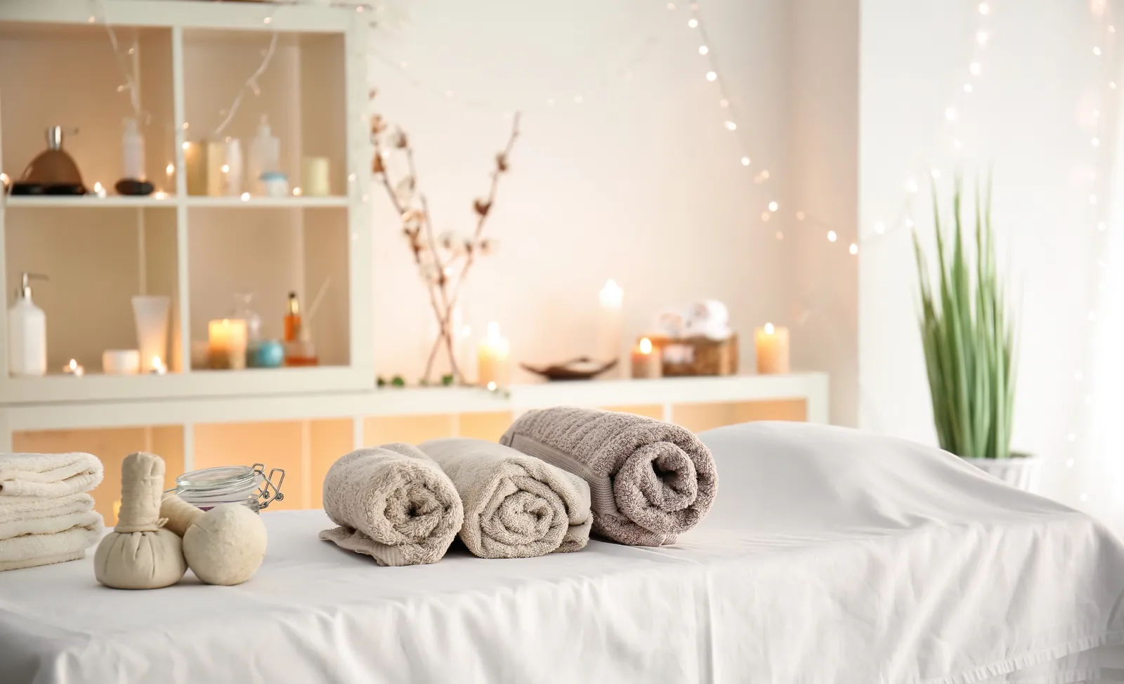 Soft towels with herbal compress bags in a beauty salon
