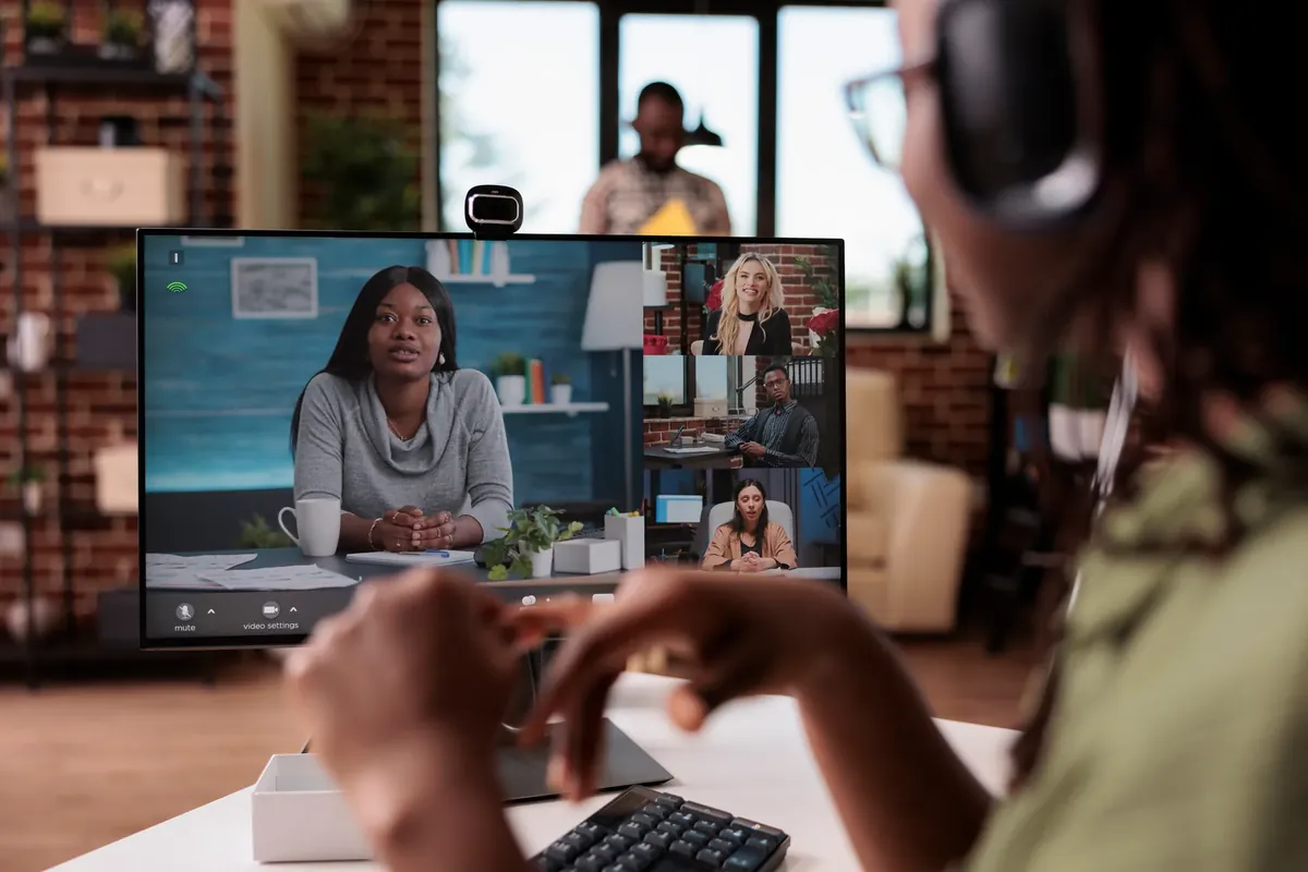 Working on a video call at a desk